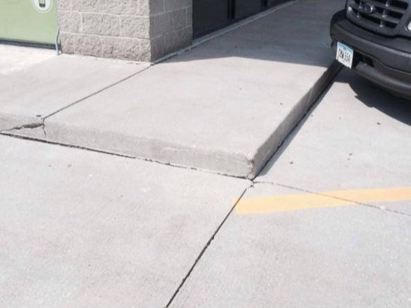 Concrete parking area after